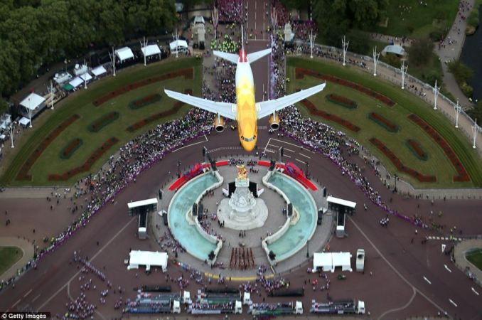 BA's 'Dove' plane design, by Tracey Emin, was flown up The Mall to thank the teams.